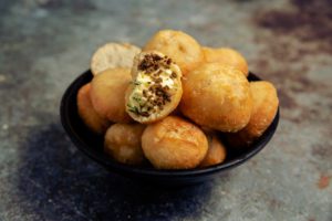 Bowl full of Golden Fried Jamaican Johnny Cakes