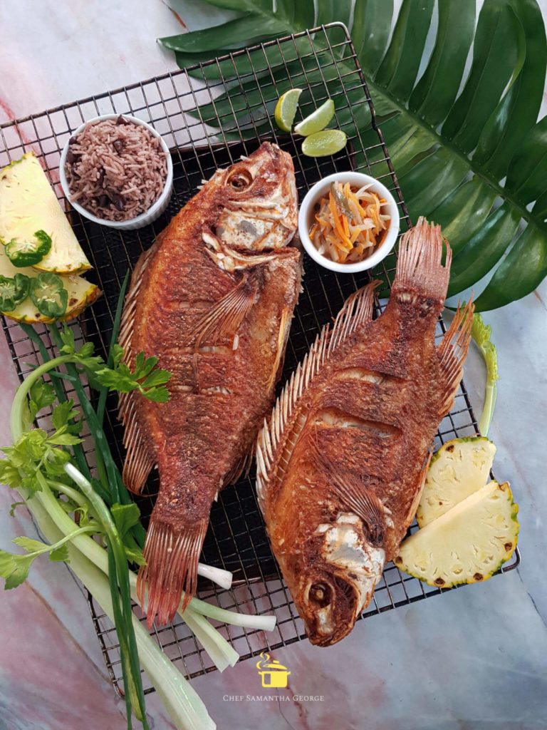 Two golden fried Escovitch Tilapia fish
