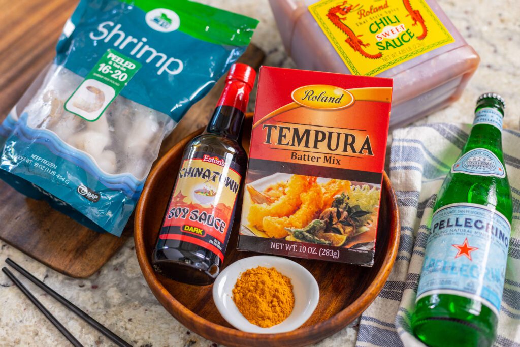 a picture of tempura mix, shrimp, soda water and more, showcasing all the elements of how to make shrimp tempura
