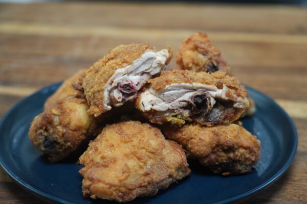 Deep Fried Chicken legs and thighs on Blue Plate