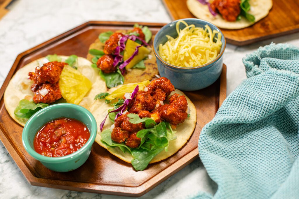 Two Open Face Buffalo Cauliflower Tacos That Have Been Cooked in Air Fryer