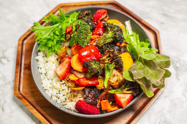 Shallow Bowl of Roasted Air Fryer Vegetables on Top of White Rice