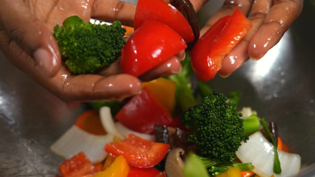Sweet Peppers and Brocolli Pieces Covered in Oil